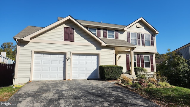 view of front of property featuring a garage