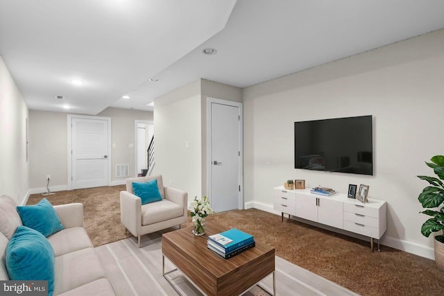 living room featuring light colored carpet