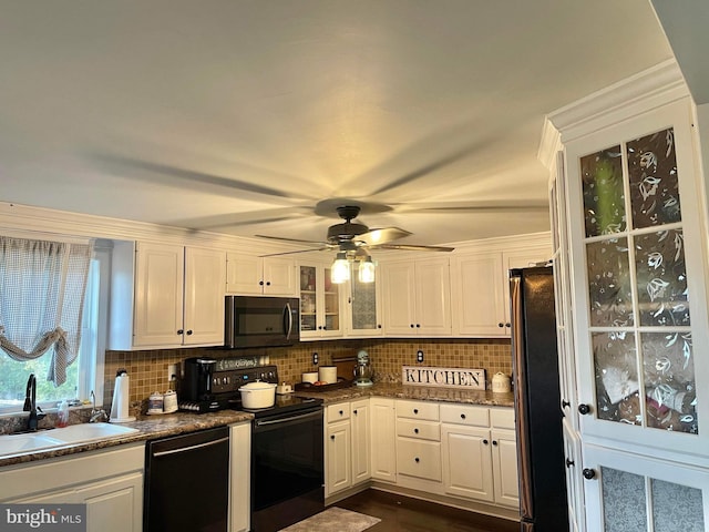 kitchen with backsplash, sink, white cabinets, appliances with stainless steel finishes, and ceiling fan