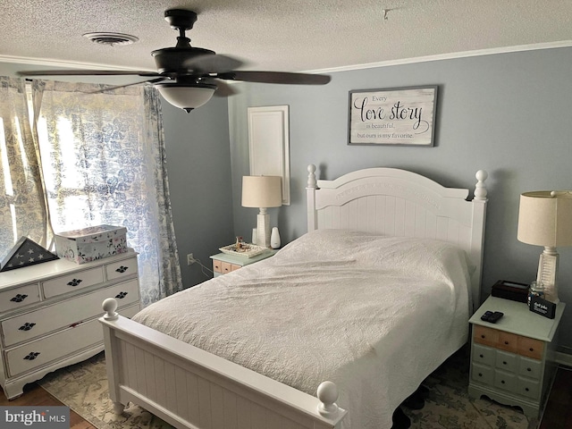 bedroom with crown molding, a textured ceiling, and ceiling fan