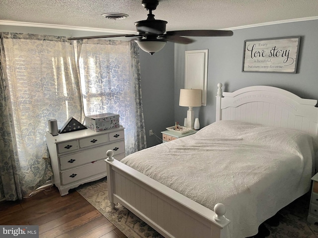 bedroom with dark wood-type flooring, crown molding, a textured ceiling, and ceiling fan