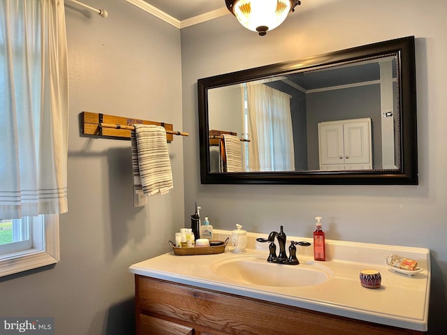 bathroom with vanity and crown molding