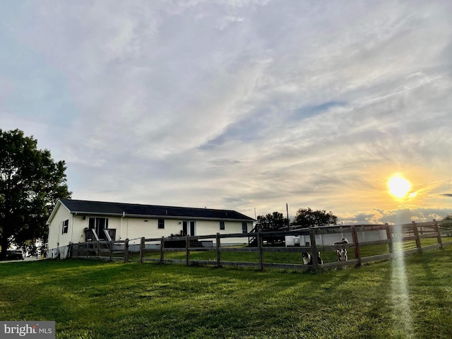 view of yard at dusk