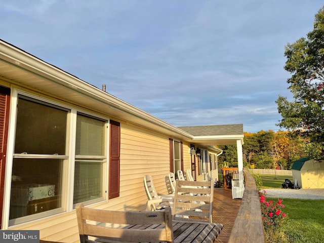 deck with a storage shed