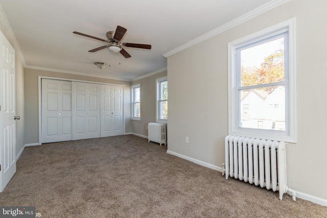 unfurnished bedroom with light carpet, ornamental molding, and radiator heating unit