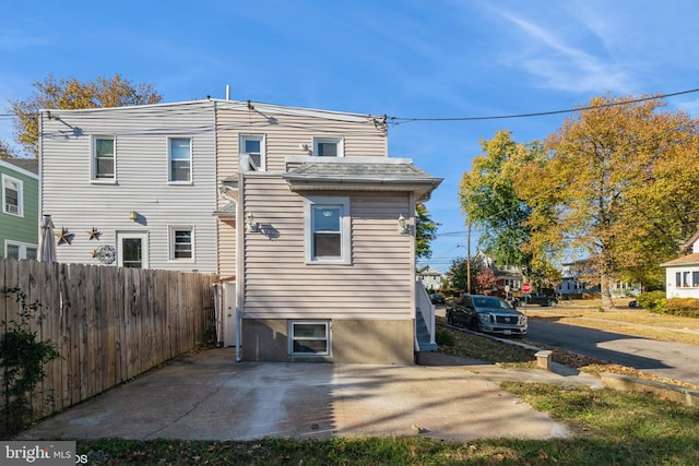 back of property with a patio