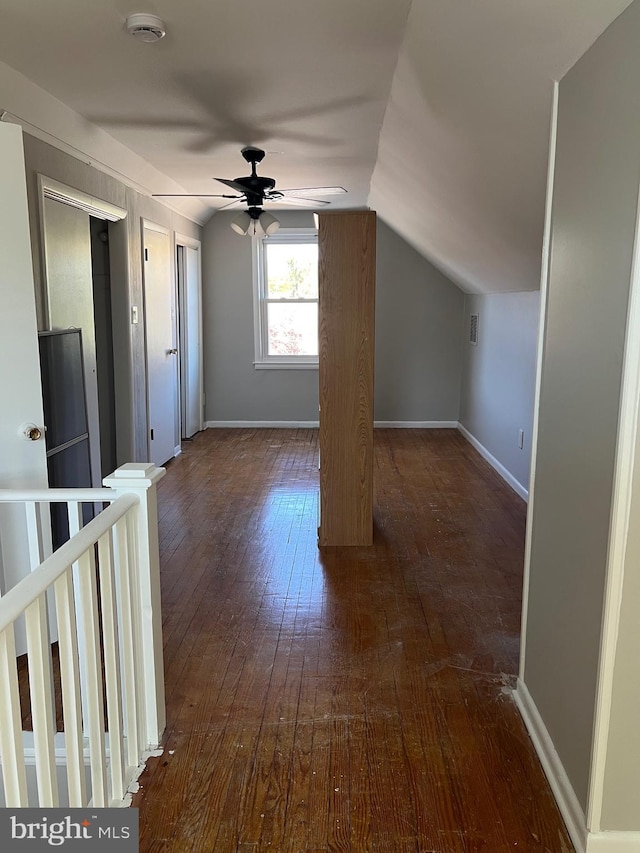 bonus room with dark hardwood / wood-style flooring, ceiling fan, and lofted ceiling