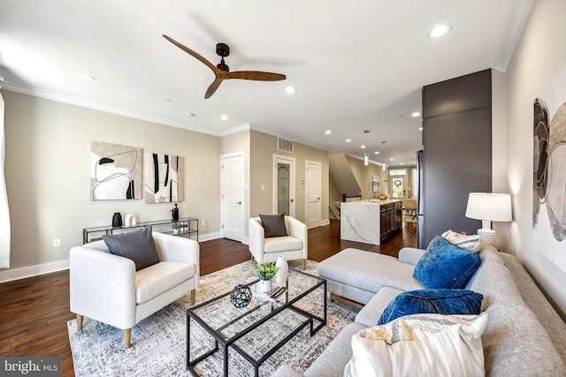 living room with ceiling fan, crown molding, and dark hardwood / wood-style floors