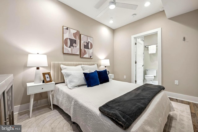 bedroom featuring connected bathroom, ceiling fan, and wood-type flooring