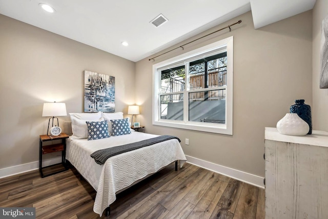 bedroom featuring dark hardwood / wood-style floors