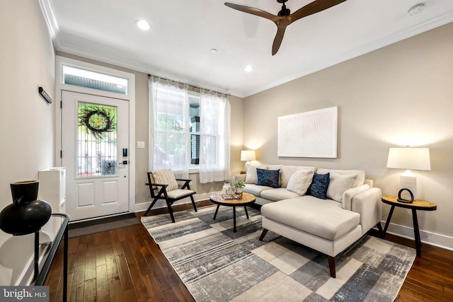 living room featuring ornamental molding, ceiling fan, and dark hardwood / wood-style floors