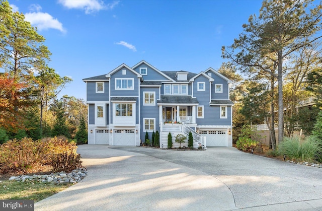 view of front facade featuring a porch and a garage