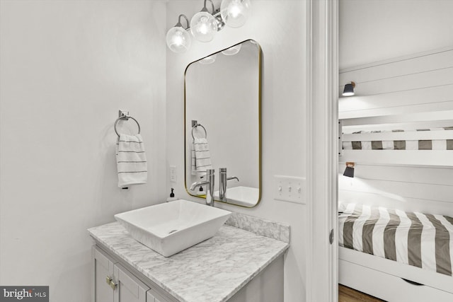 bathroom featuring vanity and hardwood / wood-style flooring