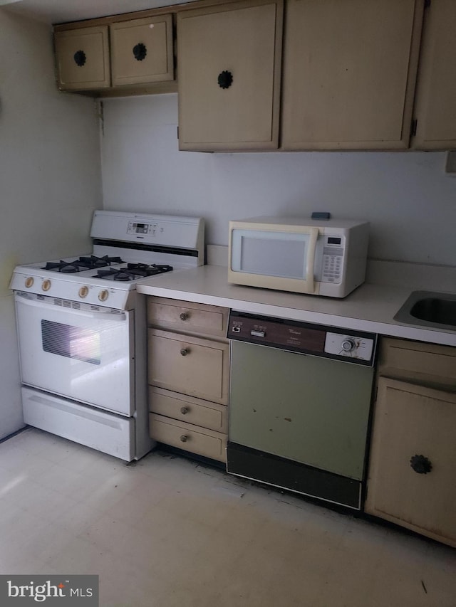 kitchen with sink and white appliances