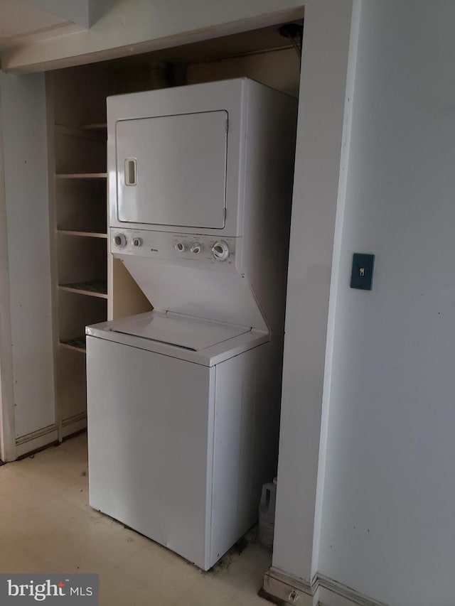 washroom with laundry area and stacked washer and dryer
