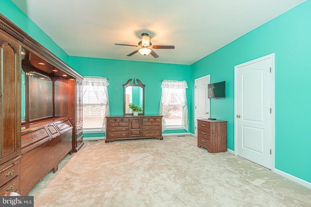 carpeted bedroom featuring ceiling fan