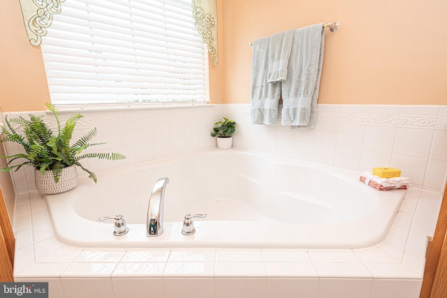 bathroom featuring tiled bath