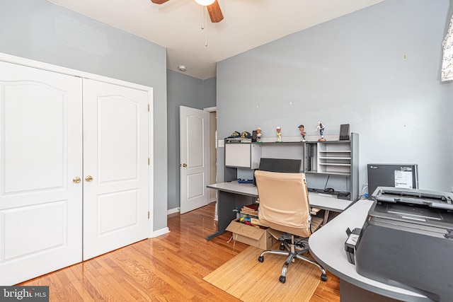 home office with ceiling fan and light hardwood / wood-style floors