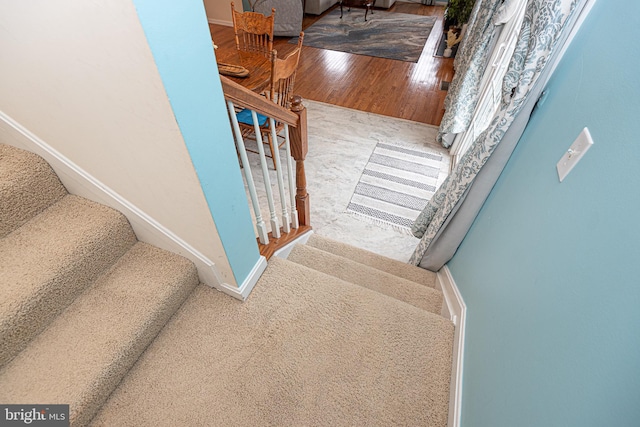 stairway with wood-type flooring