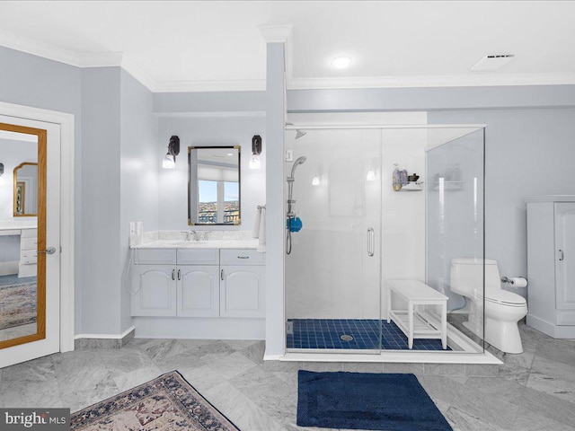 bathroom featuring crown molding, vanity, toilet, and a shower with shower door