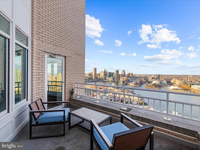 balcony featuring a water view