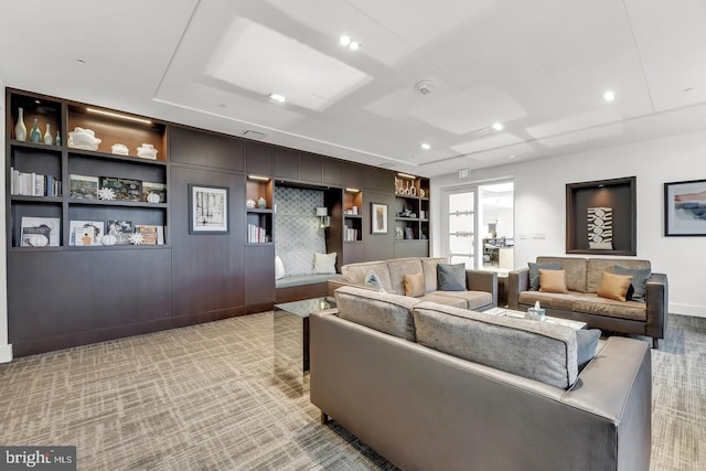 living room featuring light colored carpet and built in shelves