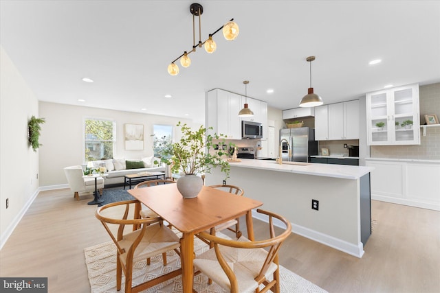 dining space featuring light hardwood / wood-style flooring