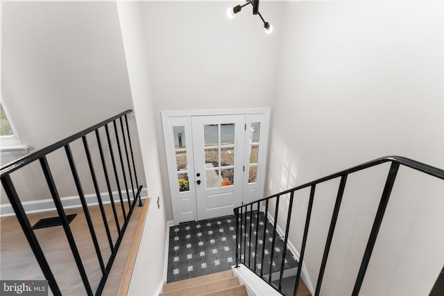 staircase featuring hardwood / wood-style floors and plenty of natural light