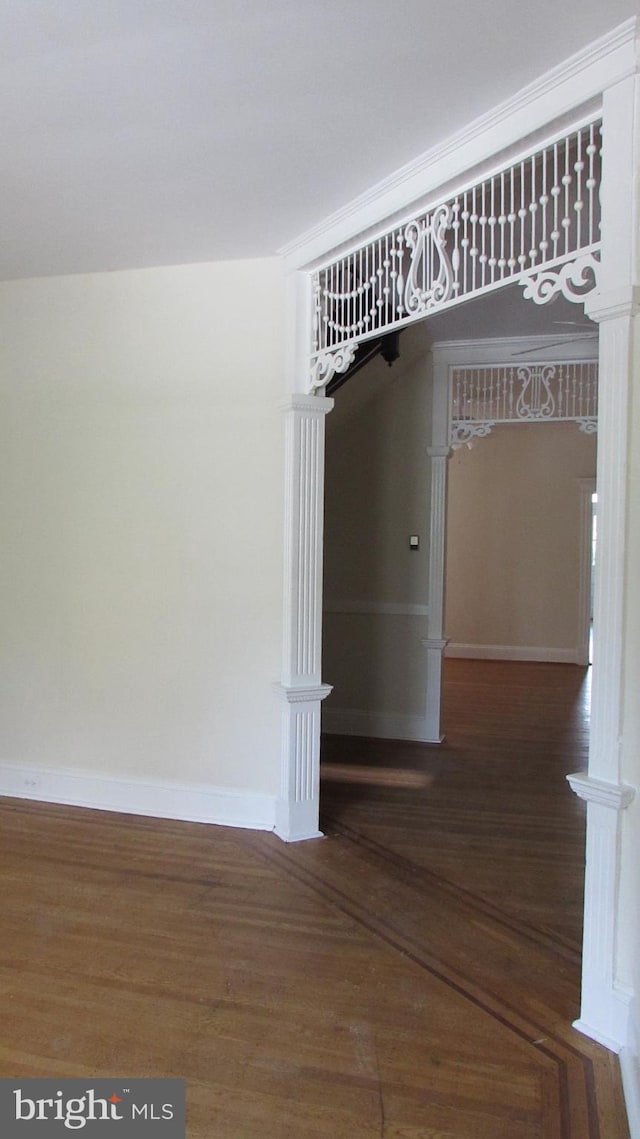 empty room with dark hardwood / wood-style floors