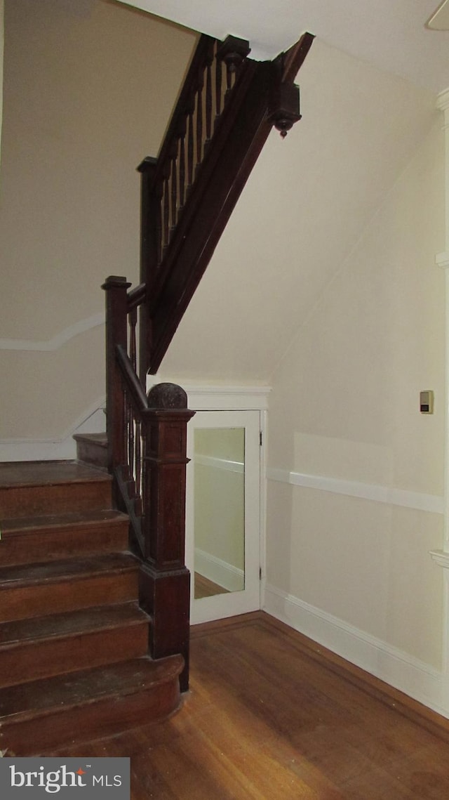 stairway featuring hardwood / wood-style floors