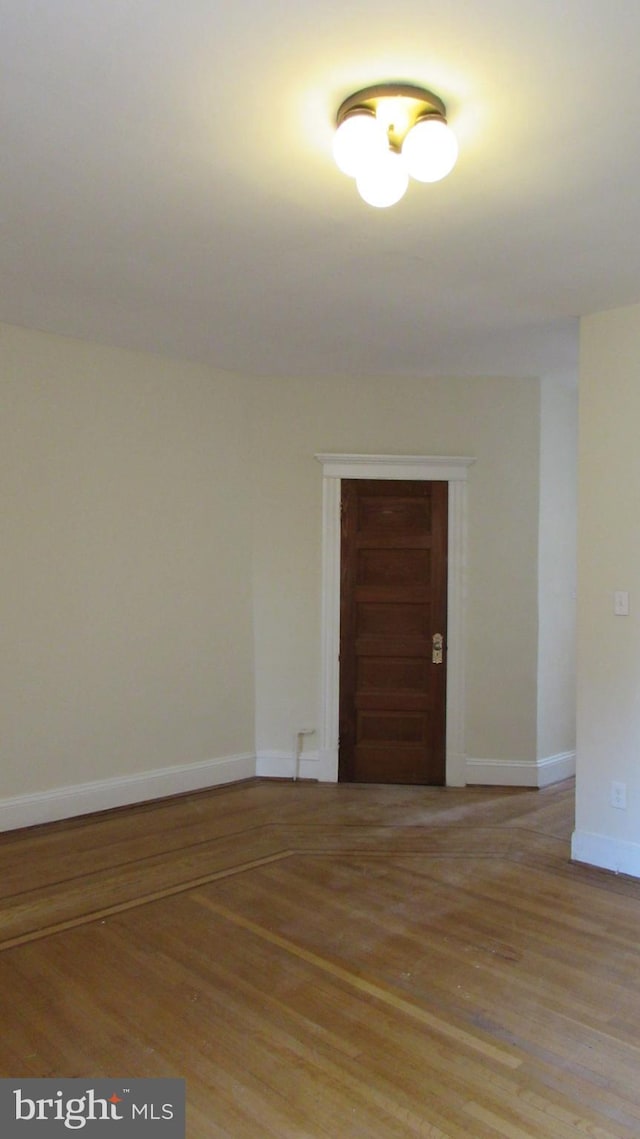 spare room with light hardwood / wood-style flooring