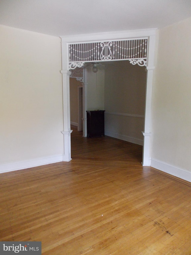 unfurnished room with hardwood / wood-style floors