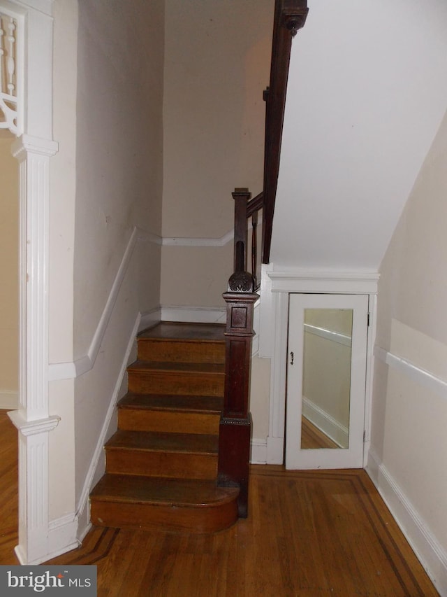 stairway featuring hardwood / wood-style floors