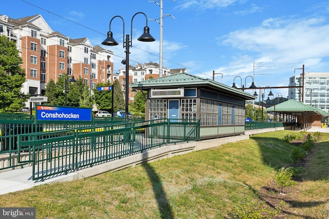 view of home's community with a lawn and a gazebo