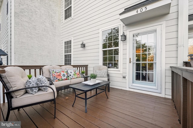 wooden terrace featuring outdoor lounge area