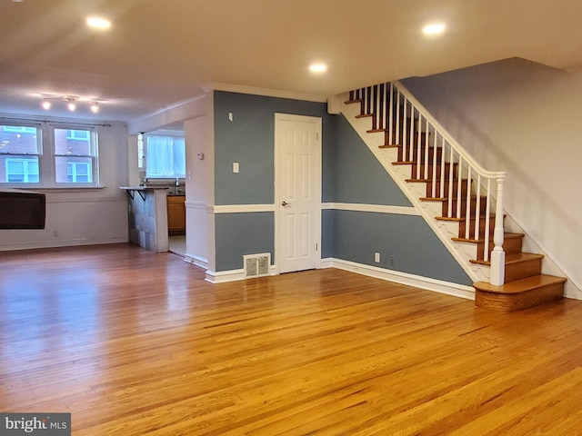 unfurnished living room featuring light hardwood / wood-style floors