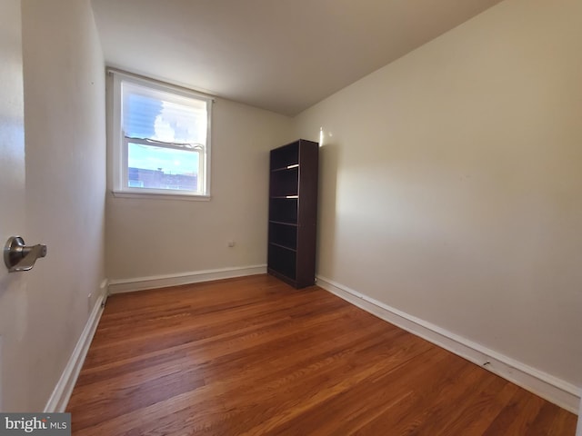 unfurnished room with hardwood / wood-style floors