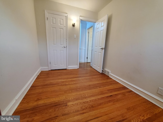 corridor featuring light hardwood / wood-style flooring