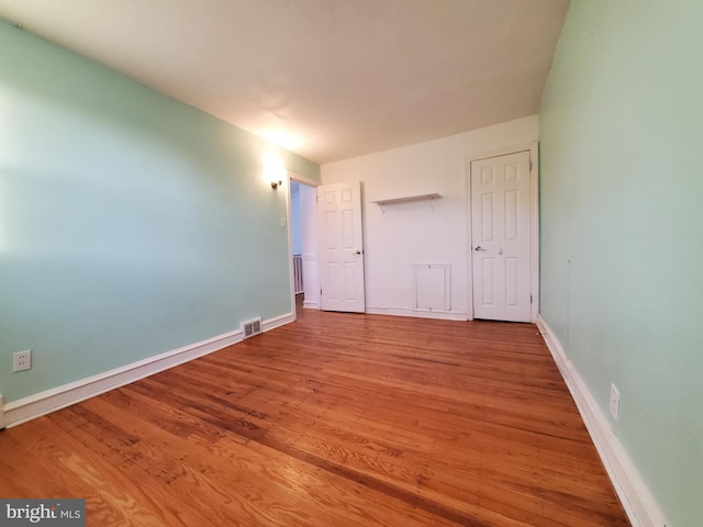 unfurnished bedroom featuring light wood-type flooring