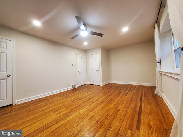 unfurnished room with light hardwood / wood-style flooring and ceiling fan