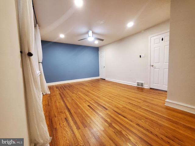 empty room featuring light hardwood / wood-style flooring and ceiling fan