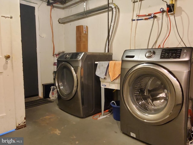 clothes washing area with independent washer and dryer