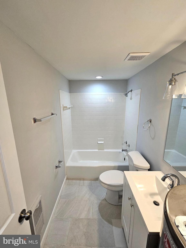 full bathroom featuring vanity, toilet, and tiled shower / bath combo