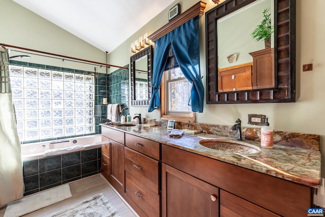 bathroom featuring vanity, lofted ceiling, hardwood / wood-style floors, and shower / tub combo with curtain