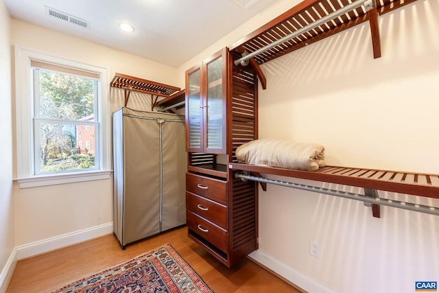 spacious closet featuring hardwood / wood-style floors