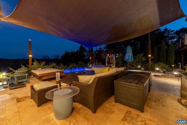 patio at twilight with outdoor lounge area