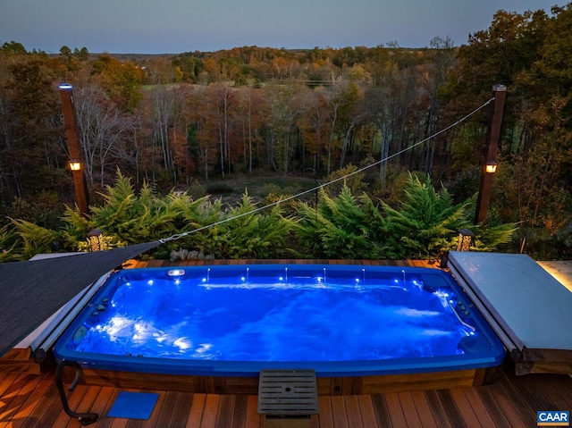 view of pool at dusk