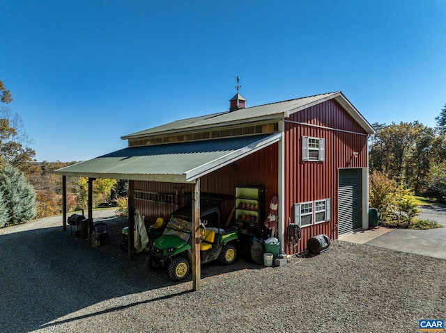 view of outbuilding with a carport