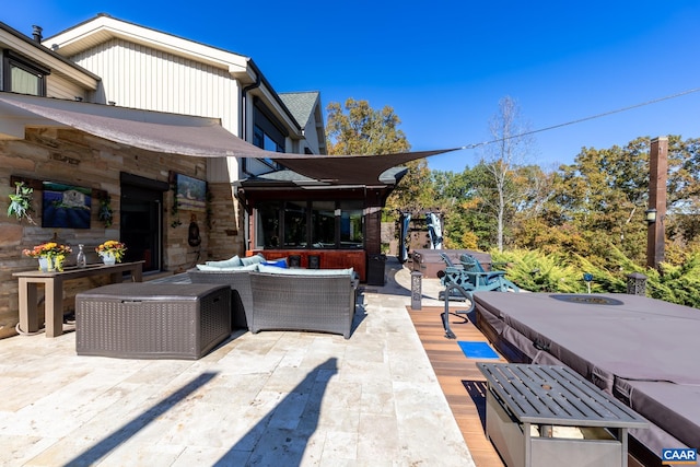 view of patio / terrace featuring an outdoor living space with a fireplace