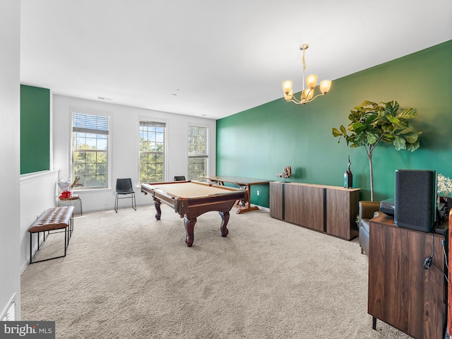 playroom featuring pool table, a chandelier, and light carpet